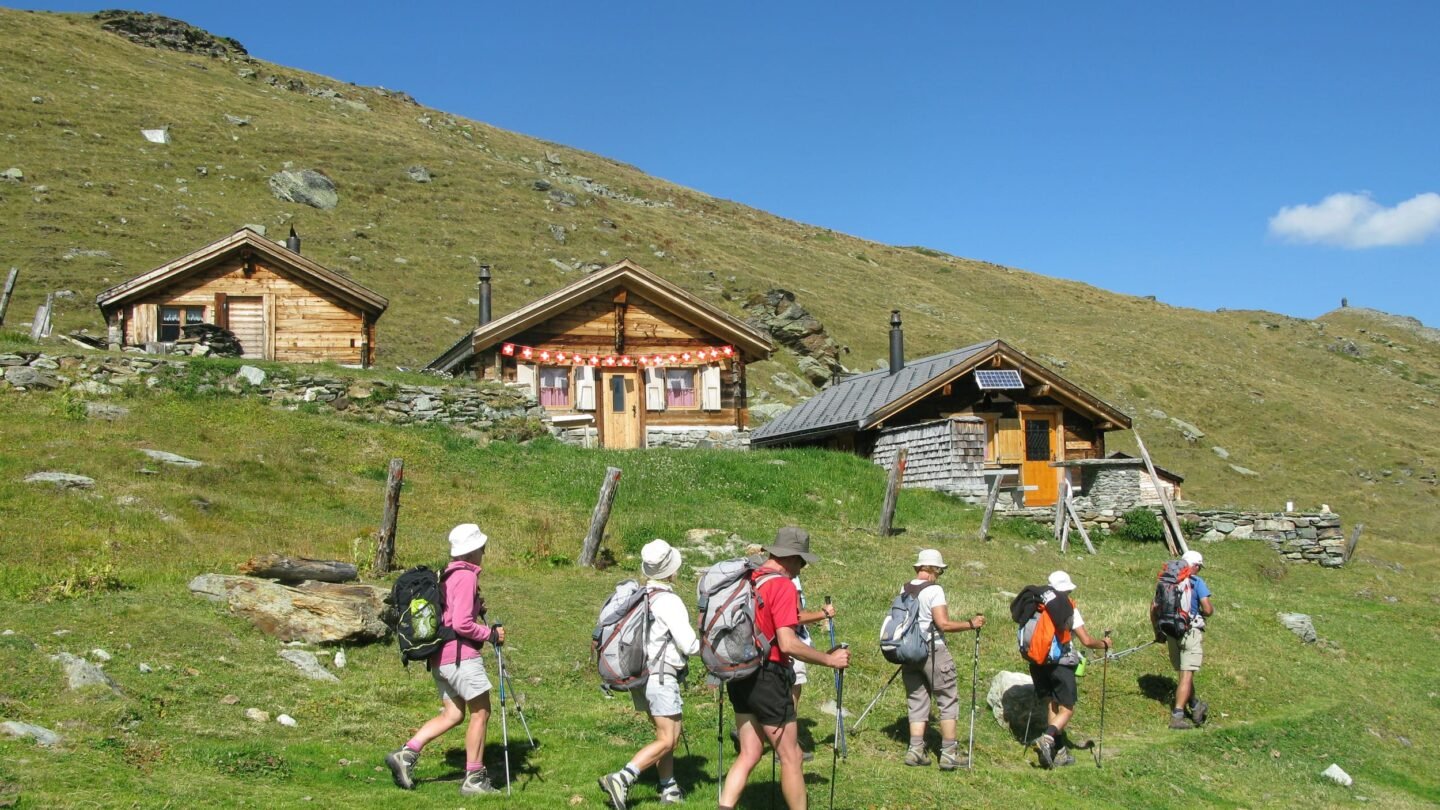 Hikers in sunny Swiss Alps