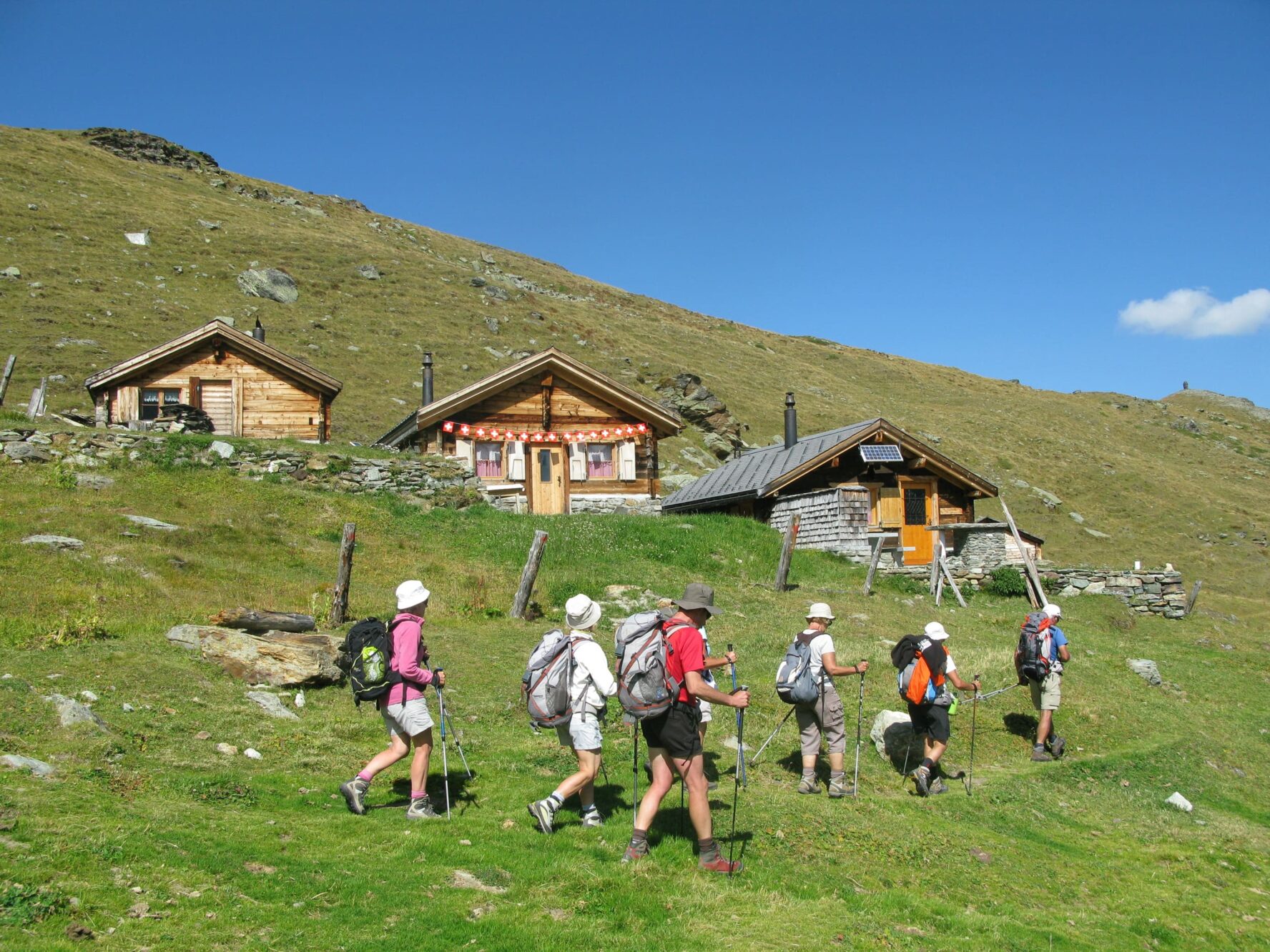 Hikers in sunny Swiss Alps