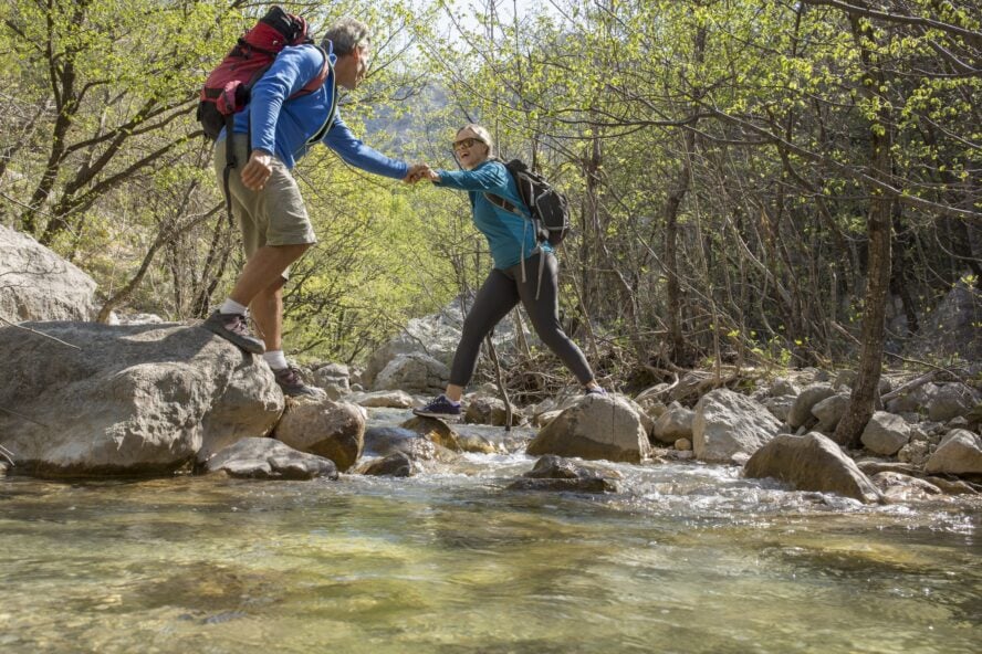 Hikers crossing a creek in Paklenica in OCtober