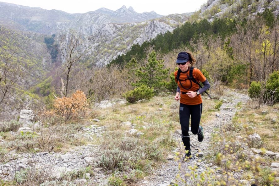 A woman running in the nature of Velebit, Croatia