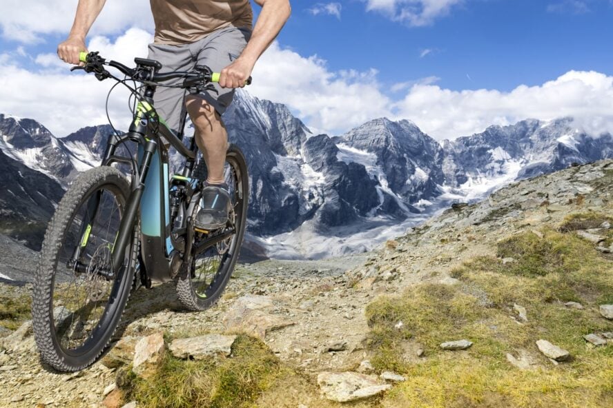 An e-bike rider on a tour du mont blanc itinerary in the European Alps
