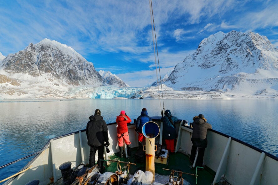 Explorers on a sailboat in Svalbard, Norway