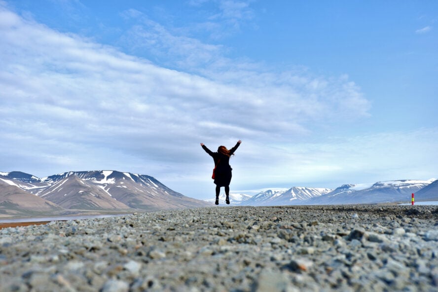 A tourist jumping in Spitsbergen, Svalbard, Arctic