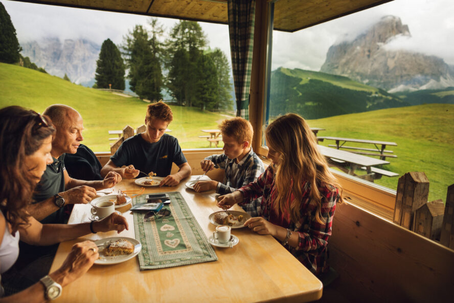 Hikers enjoying breakfast in a rifugio in the Italian Dolomites