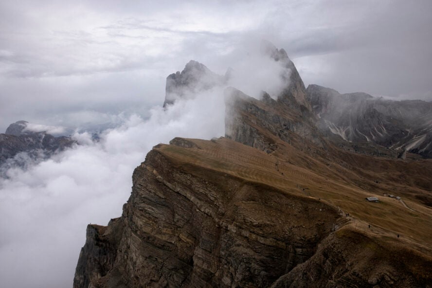 Seceda mountain in fog in autumn, Dolomites, Italy