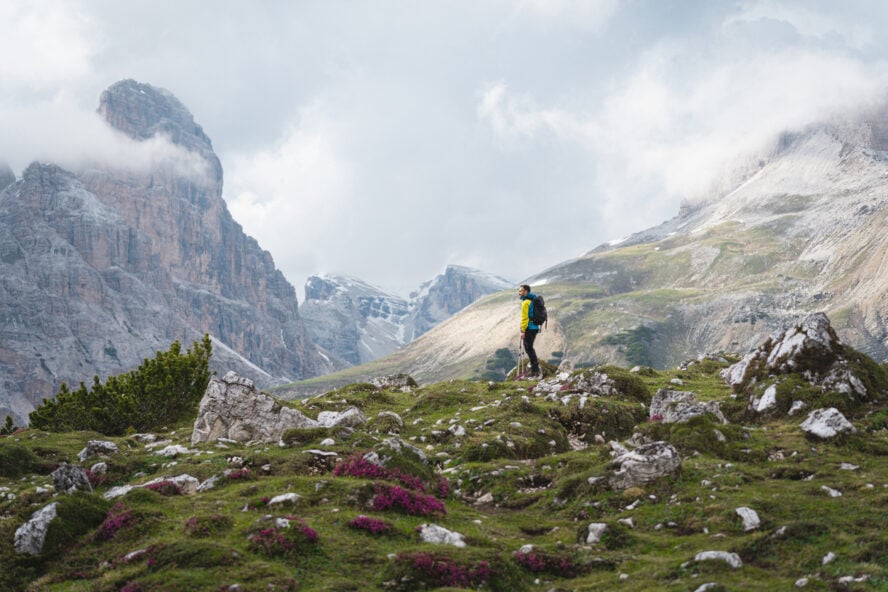 Hiker in the clouds along the Alta Via in the Italian Dolomites