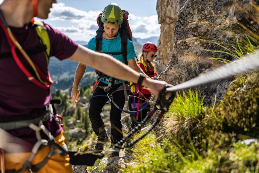 Hikers and climbers on a Via Ferrata in the Italian Dolomites