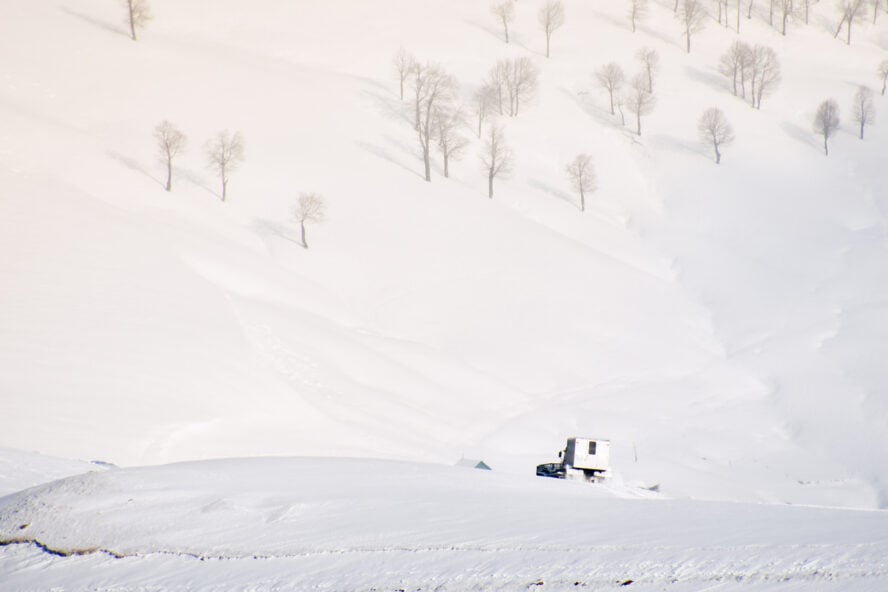 Snowcat with cabin to take skiers snowboarders freeride downhill in remote caucasus mountains in Goderdzi, Georgia