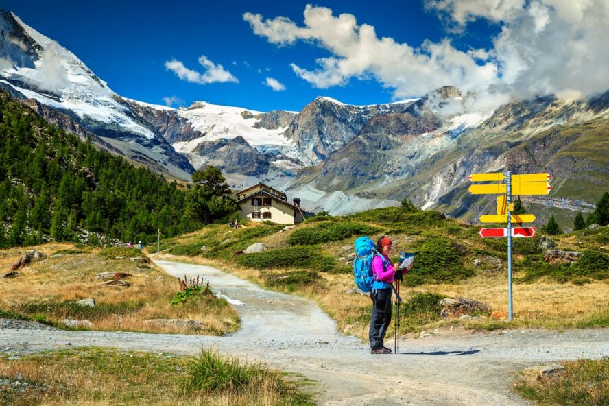 Hiker looking at a map in Zermatt, Switzerland