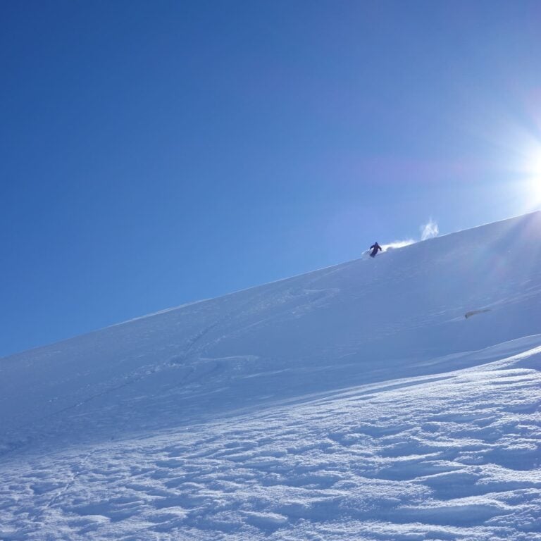 Bluebird skies heli skier