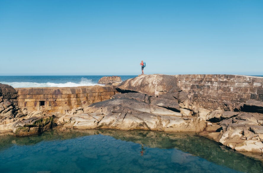 A hiker on the Camino Portuguese Coastal Route taking a photo