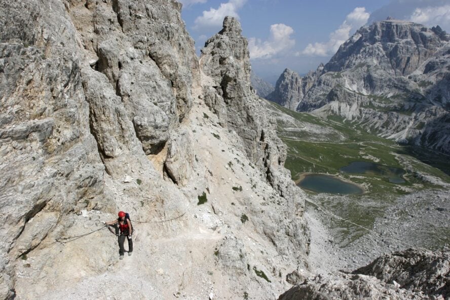 A hiker on the Via Ferrata in the Italian Dolomites