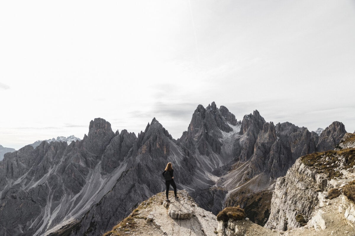 Hiker on one of the best hikes in the Dolomites, the Cinque Torri Loop, in Italy