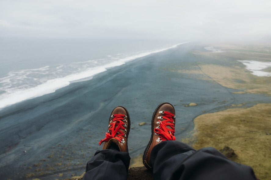 A hiker showing of his boots, an essential part of every Iceland packing list