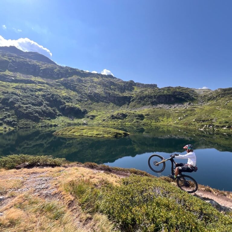 lake in mont blanc and a mountain biker
