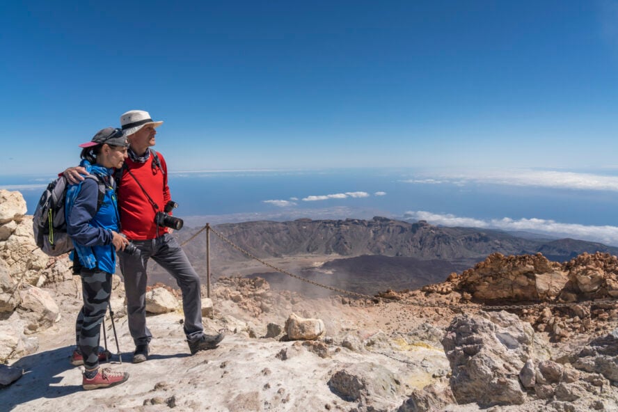 A couple of hikers posing on top of Mount Teide, Tenerife