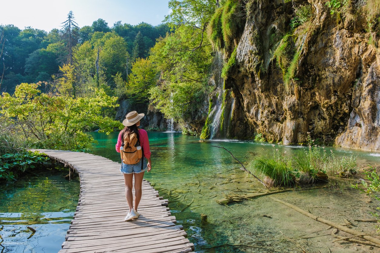 Exploring the serene beauty of Plitvice Lakes on a sunny day in Croatia