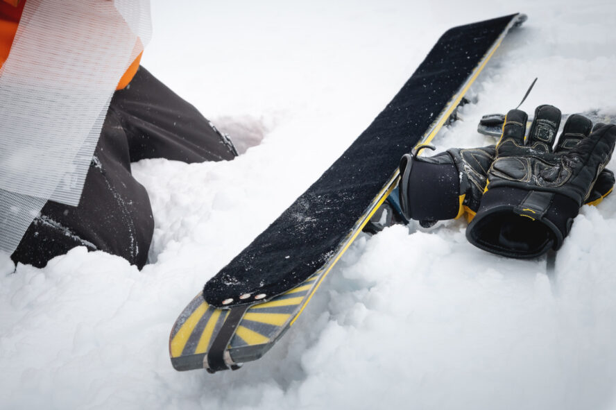 Ski touring skins being replaced by a skier.