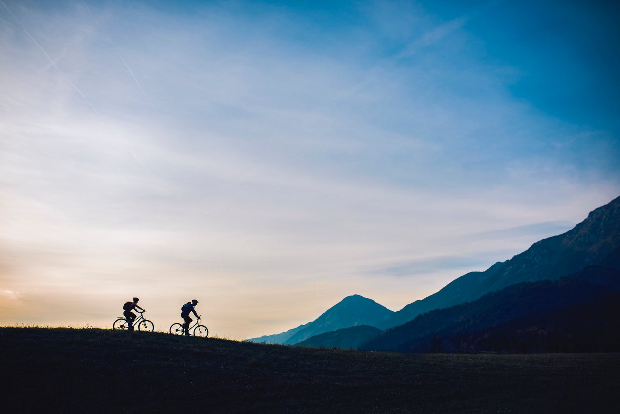 Riders crossing a beautiful landscape on Slovenia bike tours