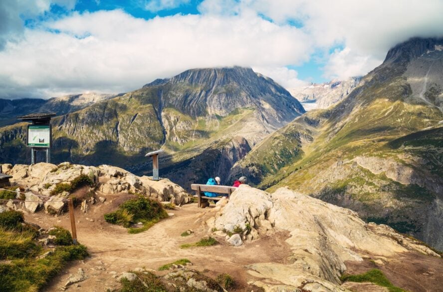 Hikers resting near Aletsch Glacier in Switzerland