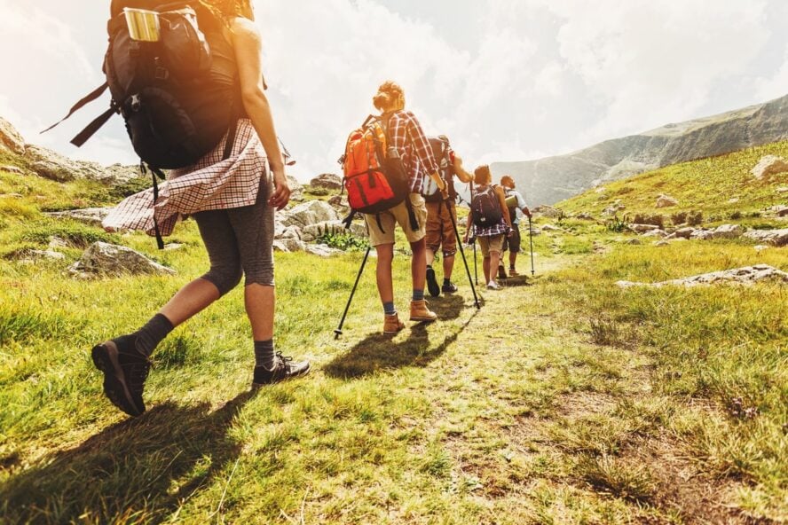 Hikers walking in line on a mountain