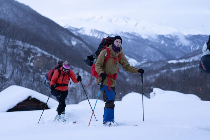 Two backcountry skiers on an adventure in Racha