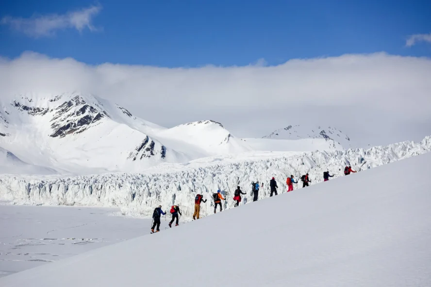 A group of skiers exploring the Svalbard archipelago in Norway