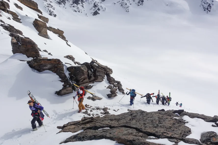 Skiers hiking through snow in Svalbard, Norway