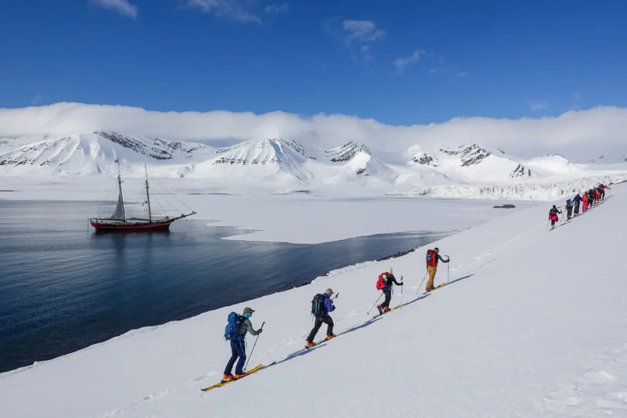 Enjoying a skiing and sailing adventure in Svalbard, Norway