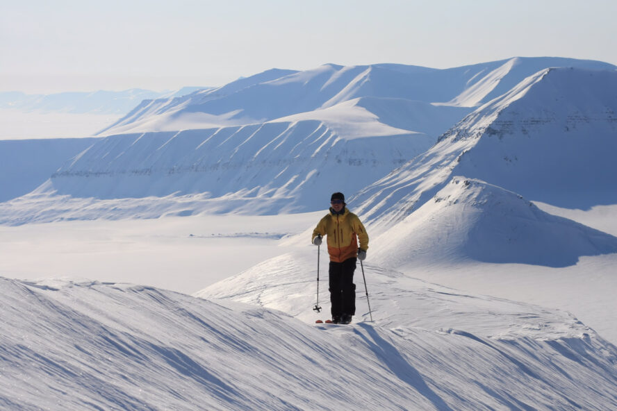 A skier looking at Svalbard from up above