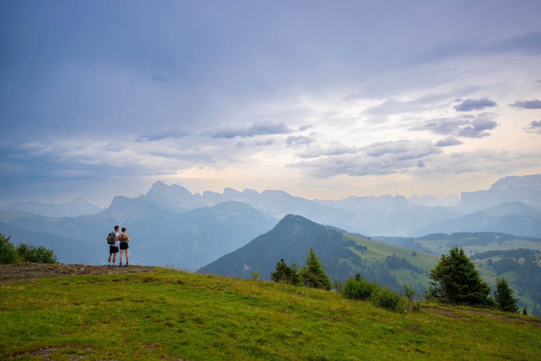 two hikers dolomites summer