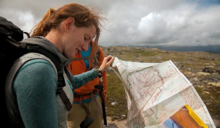 Alaska woman reading a map