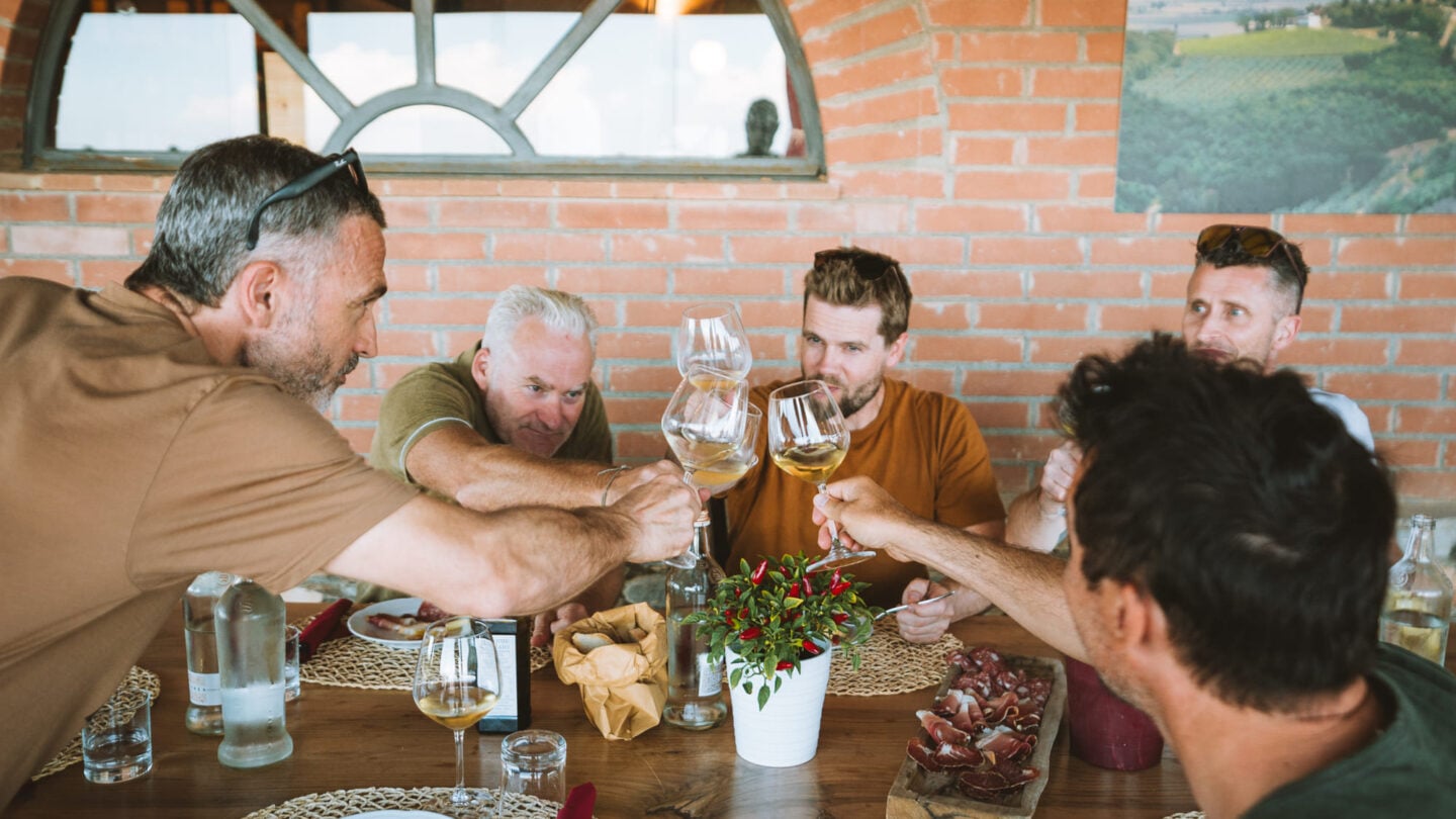 Bikers drinking wine in Tuscany