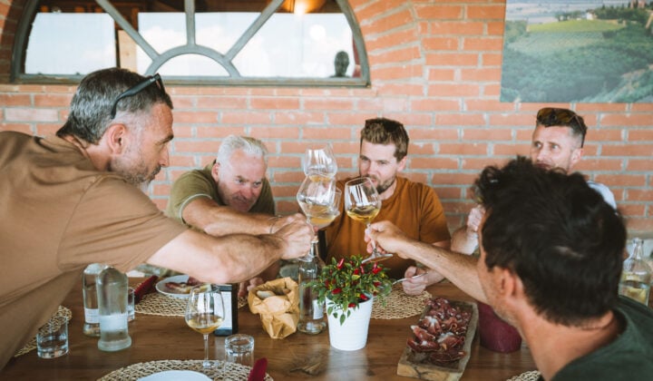 Bikers drinking wine in Tuscany