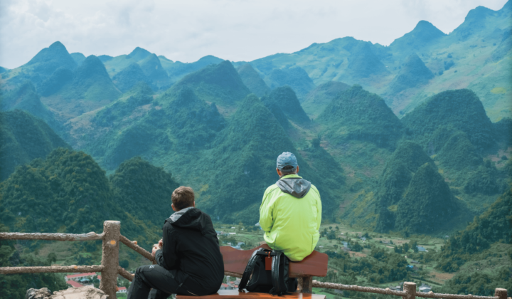 Cyclists high in Vietnam on a bench