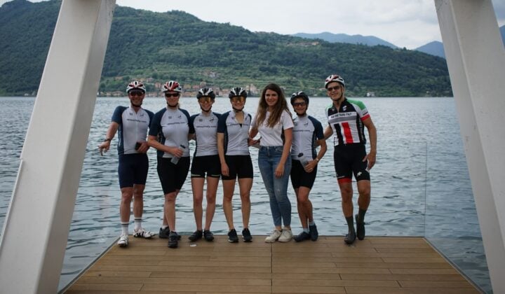 Group of bikers next to a lake in Italy