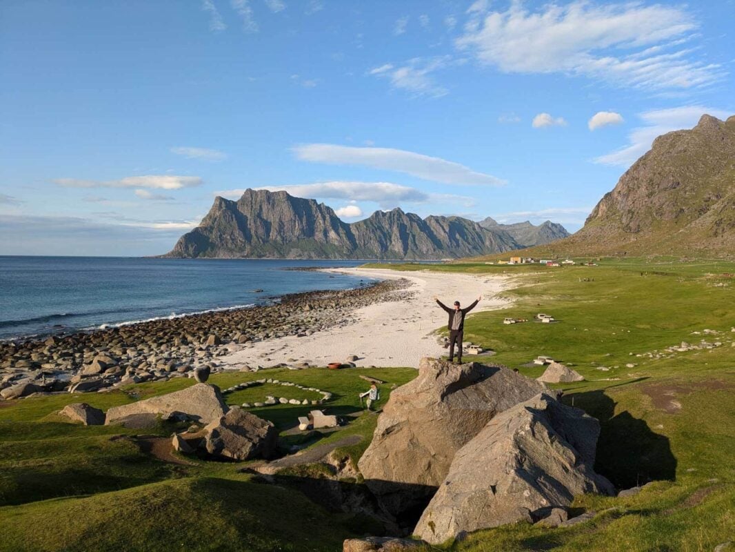 Hiker on a rock on a beach in Norrway