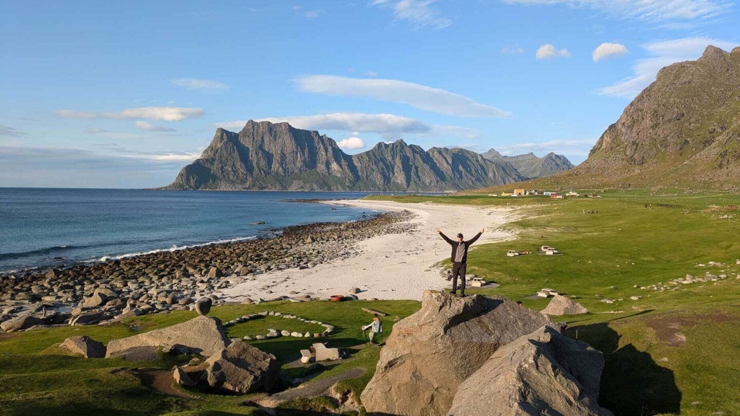 Hiker on a rock on a beach in Norrway