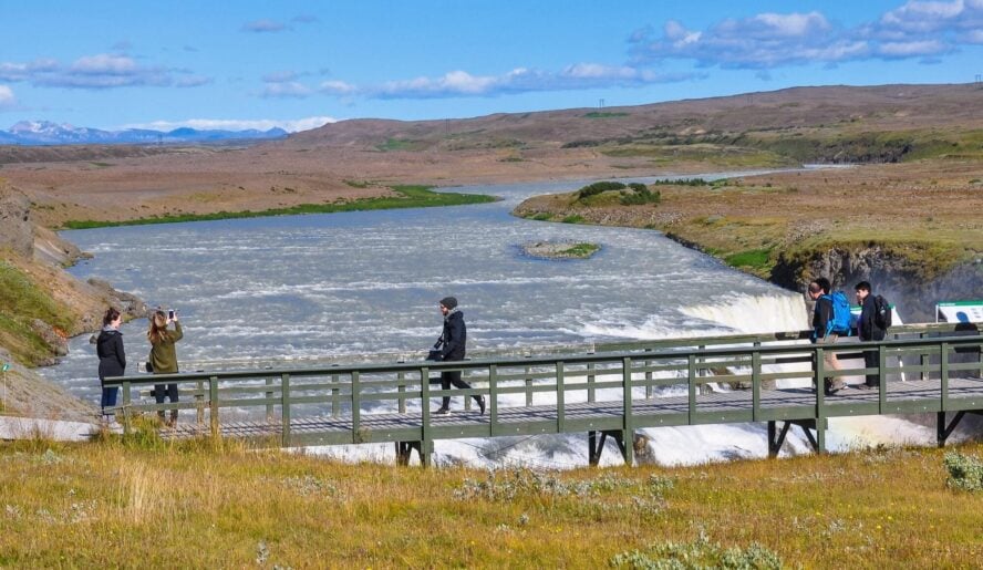 Hikers on a bridge in Iceland
