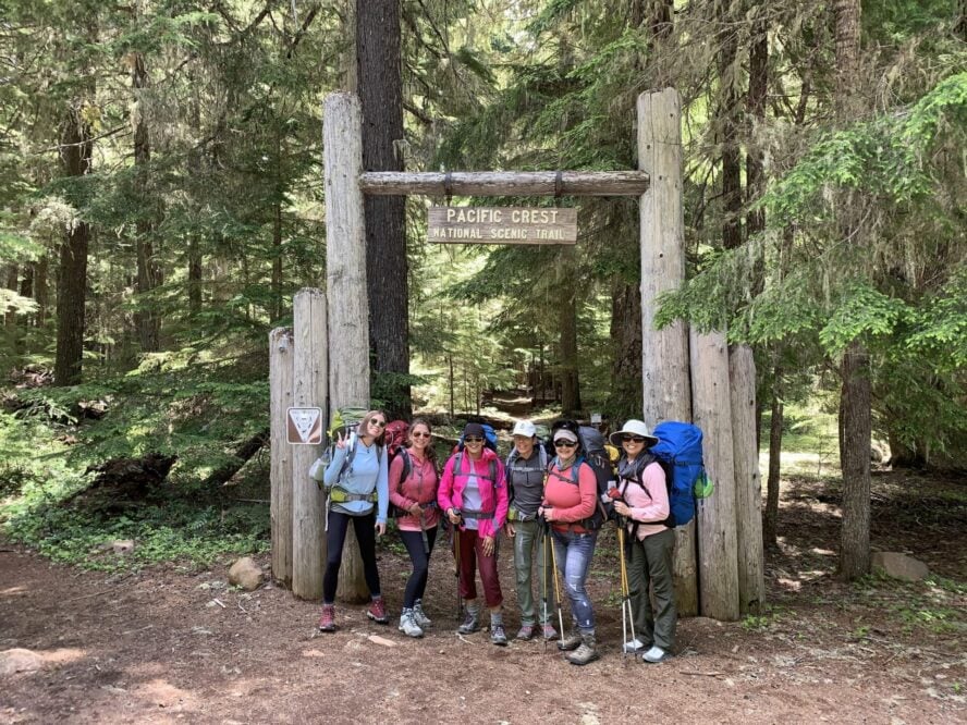 Hikers posing near a trail