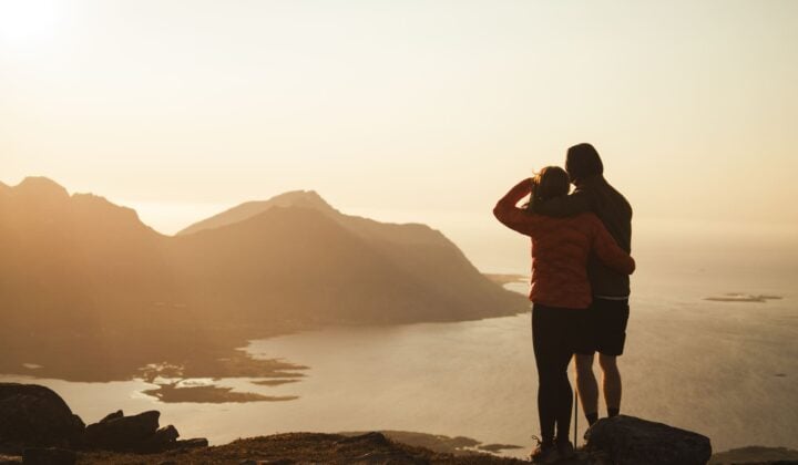 Hikers watching the sunset in Lofoten