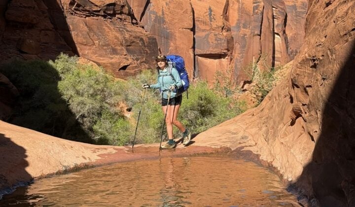Hiking with poles near water in Utah