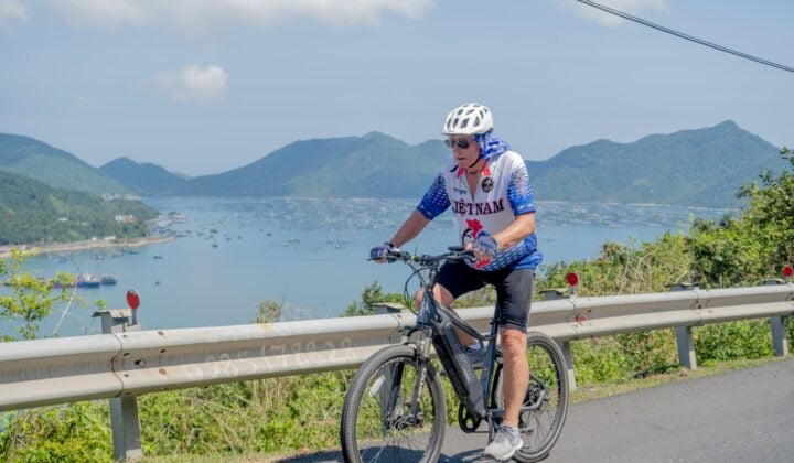 Old guy cycling seaside