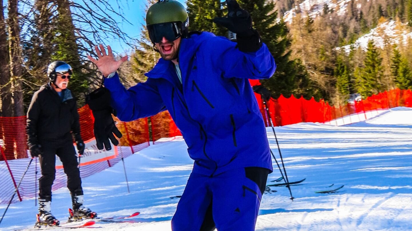 Skier waving in Dolomites