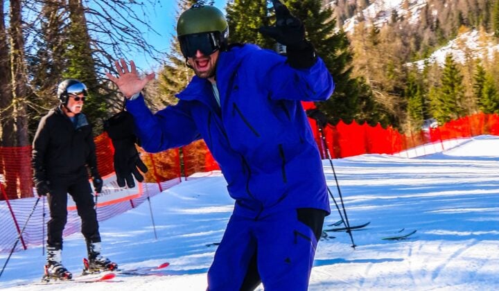 Skier waving in Dolomites