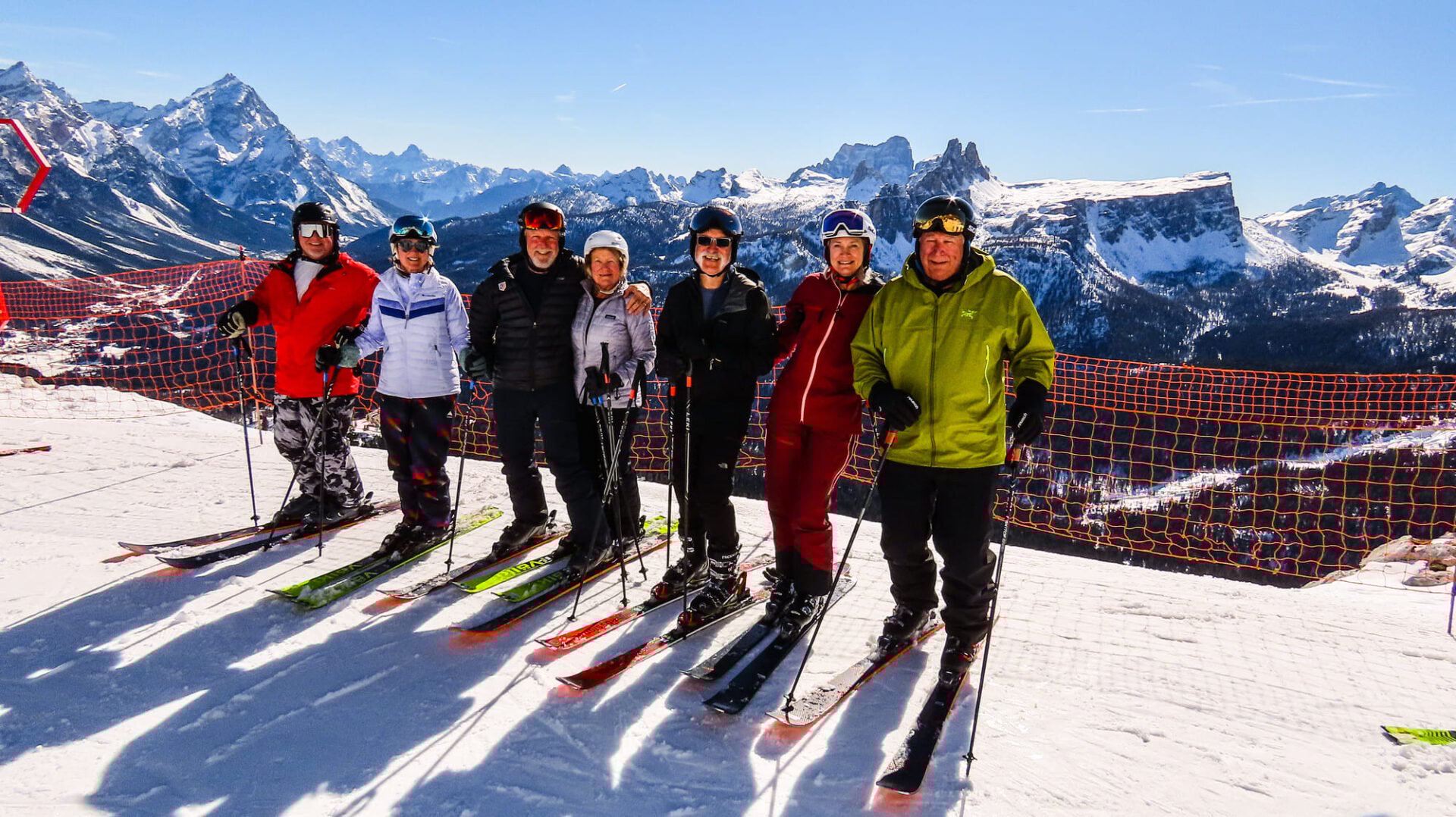 Skiers posing in the Dolomites
