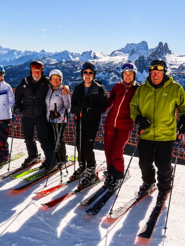 Skiers posing in the Dolomites