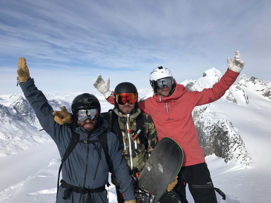 Three skiers celebrating a good descent in East Greenland