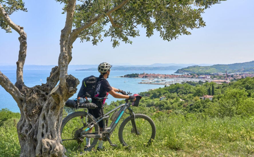 Woman biking near the Adriatic sea
