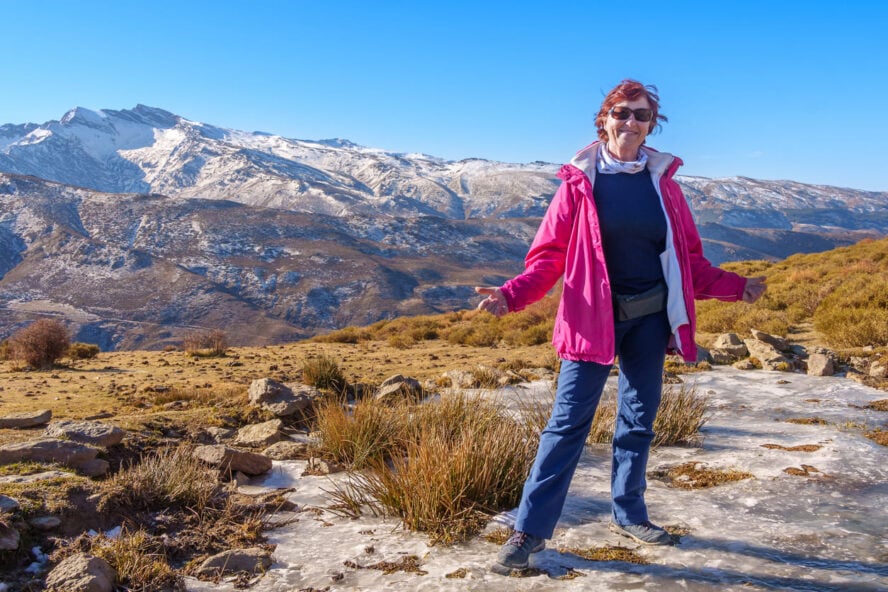 Woman hiking on a frozen trail